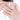 Woman's hand wearing the women's adjustable silver-tone halo ring with a cubic zirconia center stone