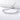 Pulsera tenis ajustable plateada con circonitas cúbicas sobre una superficie blanca