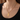 Woman wearing a gold-tone engraved bar pendant necklace with small engraved text
