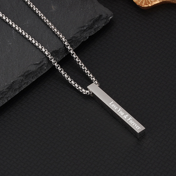 Silver square prism necklace engraved with Love You & Forever on a dark slate surface