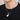 Hombre con un collar plateado con dije de guitarra grabado con Love You