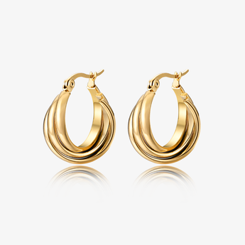 Gold-tone twisted triple hoop earrings with hinged closure on white background