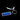 Blue engraved rectangular keychain and car key on a dark surface