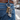 Custom engraved motorcycle keychain on a bunch of keys hanging from a belt loop on blue jeans