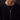 Man wearing a silver-tone slider chain necklace with ball ends over a black sweater