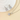Silver-tone round stone necklace and matching earrings on a pale surface