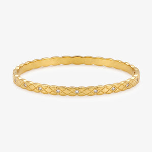 Gold-tone lattice bangle with small clear accents